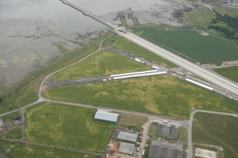 Oblique aerial view of Evanton airfield, looking SSE.