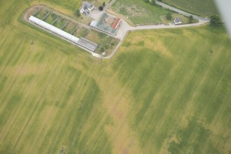 Oblique aerial view of the cropmarks of the possible unenclosed settlement, looking SE.