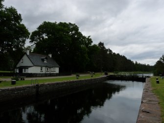 Kytra Lock looking east from S bank with several bollards & Vatersay cottage