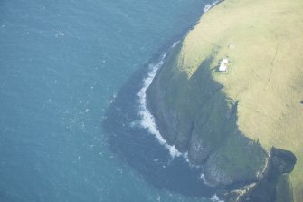 Oblique aerial view of Tobha Ronaigh, centred on Rona lighthouse, looking to the S.