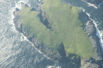 Oblique aerial view of the hut on Eilean Tighe, Flannan Isles, looking to the WNW.