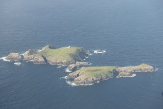 General oblique aerial view of Eilean Mor and Eilean Tighe, looking to the N.