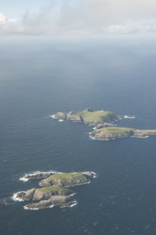 General oblique aerial view of Soraigh with Eilean Mor and Eilean Tighe beyond, looking to the N.
