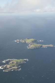 General oblique aerial view of Soraigh with Eilean Mor and Eilean Tighe beyond, looking to the N.