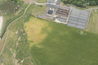 Oblique aerial view of the remains of the windmill at Sandend, looking E.