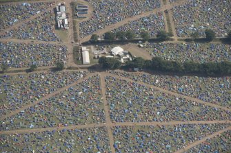 Oblique aerial view of the T in the Park festival at Balado, looking SSE.