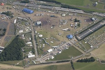 Oblique aerial view of the T in the Park festival at Balado, looking SSE.