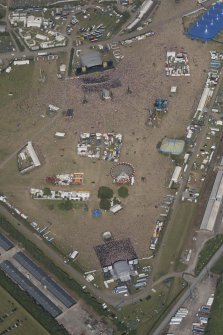 Oblique aerial view of the T in the Park festival at Balado, looking ENE.