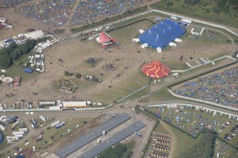 Oblique aerial view of the T in the Park festival at Balado, looking NNE.