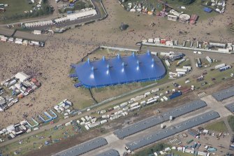 Oblique aerial view of the T in the Park festival at Balado, looking NNE.