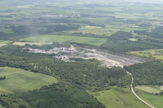 General oblique aerial view of Tom's Forest, Kemnay, grantite quarry, looking to the SSE.