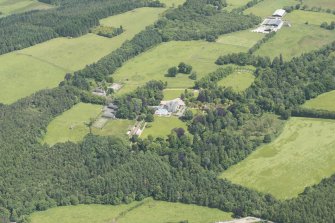 General oblique aerial view of Glassel House and its policies with Mains of Glassel beyond, looking to the ENE.