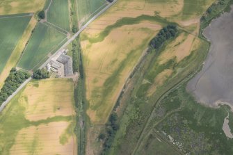 Oblique aerial view centred on the cropmarks at Gilrivie, looking ENE.