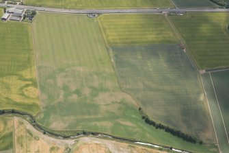 Oblique aerial view of the cropmarks at Drumnagair, looking SE.