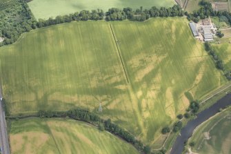 Oblique aerial view of the cropmarks at Balmakewan, looking ENE.