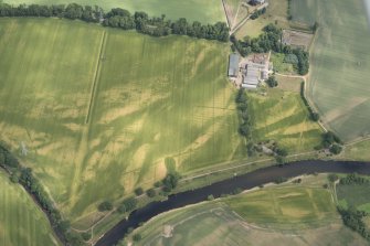 Oblique aerial view of the cropmarks at Balmakewan, looking ENE.