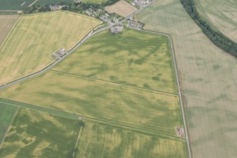 Oblique aerial view centred on the cropmarks at Inchbare and Ballownie, looking NW.