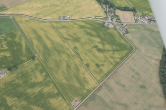 Oblique aerial view centred on the cropmarks at Inchbare and Ballownie, looking W.