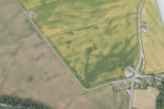 Oblique aerial view centred on the cropmarks at Inchbare and Ballownie, looking S.