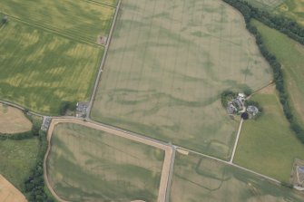 Oblique aerial view of the cropmarks of Strathacro Roman temporary camp, looking W.