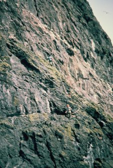 Stuart Murray roping down the pitch, S Rae's head below, Stac Lee..