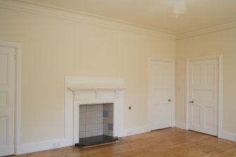 Interior, detail of fireplace and doors in dining room.