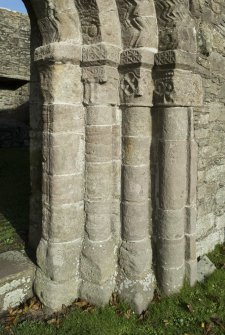 Exterior. South doorway. Detail of north east grouping of inner/outer facing capitals