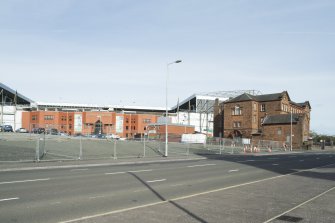 Exterior. General view from the west showing Parkhead Stadium in the background.