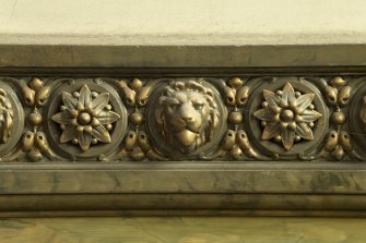 1st floor, staircase, close detail of lions' heads decoration on dado