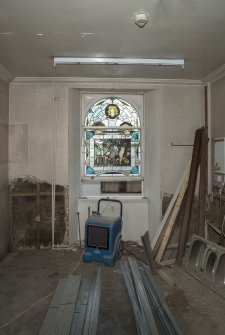 Ground floor, kitchen, view from south showing stained glass window