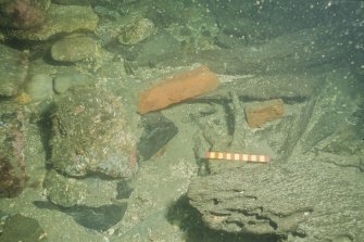 Bricks and coal from the collapsed galley debris at the forward part of the wreck. Scale 15 centimetres. (Colin Martin)