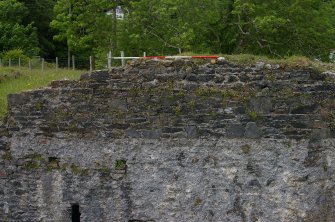 The upper rear SE face of the main kiln building showing structural features indicative of a bridge linking its upper level with Kiln A. Scale 2 metres. (Colin Martin)