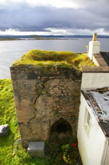 View from the top of Kiln B towards Kiln A, showing its relationship with the adjoining cottage. This is where the putative bridge would have crossed. (Colin Martin)