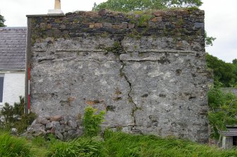 The S face of Kiln A showing the roof raggles of two phases of lean-to structures, and extensive areas of harling. The upper stonework shows no evidence of harling and may be a later phase. Scale 2 metres. (Colin Martin)