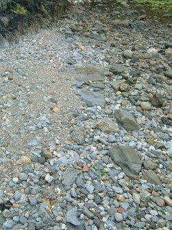 The somewhat fugitive line of stones fronting the fore-shed which marks the footings of the high-water quay (Paula Martin)
