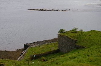 Kiln 3 and its extension from the N, showing the quay on the left. Beyond, at top centre, is a horseshoe-shaped reef (an Càrn = pile of stones) which appears to have served as a ballast dump. (Colin Martin)