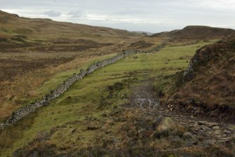 The Slochd Dubh – Black Dyke – a stone wall running from one side of the Rubh’ an Dùnain peninsula to the other, evidently defining a territorial boundary. Though the present wall is relatively modern its line shows modifications and traces of earlier structures, and the line may be of some antiquity. (Colin Martin)