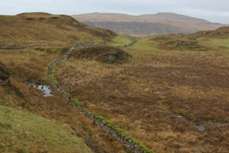 The Slochd Dubh – Black Dyke – a stone wall running from one side of the Rubh’ an Dùnain peninsula to the other, evidently defining a territorial boundary. Though the present wall is relatively modern its line shows modifications and traces of earlier structures, and the line may be of some antiquity. (Colin Martin)