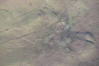 Oblique aerial view of the remains of the farmstead, looking to the NNW.