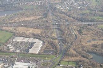 Oblique aerial view of the Low Parks area of Hamilton with Junction 6 of the M74 beyond, looking to the NE.