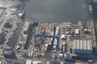Oblique aerial view of Rosyth Dockyard showing the construction of the new aircraft carrier, HMS Queen Elizabeth, looking S.