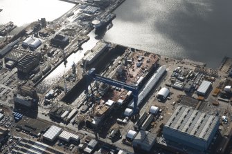 Oblique aerial view of Rosyth Dockyard showing the construction of the new aircraft carrier, HMS Queen Elizabeth, looking SSE.