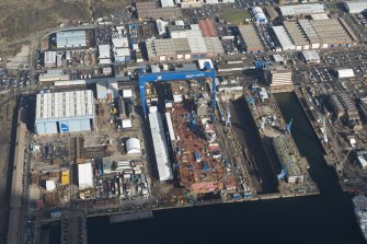 Oblique aerial view of Rosyth Dockyard showing the construction of the new aircraft carrier, HMS Queen Elizabeth, looking NE.