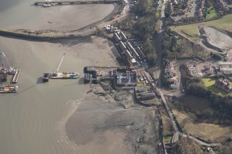 Oblique aerial view of the construction of the new Queensferry crossing at Inchgarvie House, looking ESE.