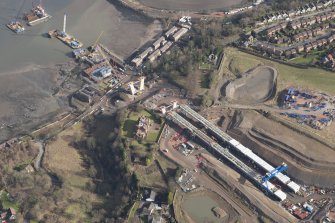 Oblique aerial view of the construction of the new Queensferry crossing at Inchgarvie House, looking ENE.