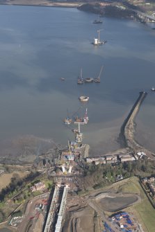 Oblique aerial view of the construction of the new Queensferry crossing at Inchgarvie House, looking NNE.