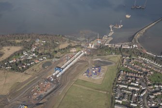 Oblique aerial view of the construction of the new Queensferry crossing at Inchgarvie House, looking NNW.