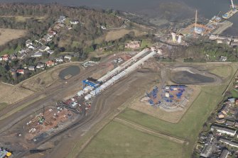 Oblique aerial view of the construction of the new Queensferry crossing at Inchgarvie House, looking NW.