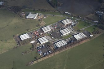 Oblique aerial view of Throsk Royal Naval Armament Depot, looking NE.
