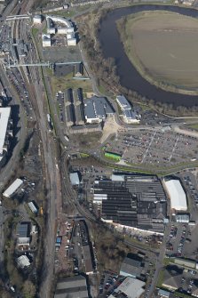 Oblique aerial view of The Barracks and Phoenix Industrial Estate, looking N.